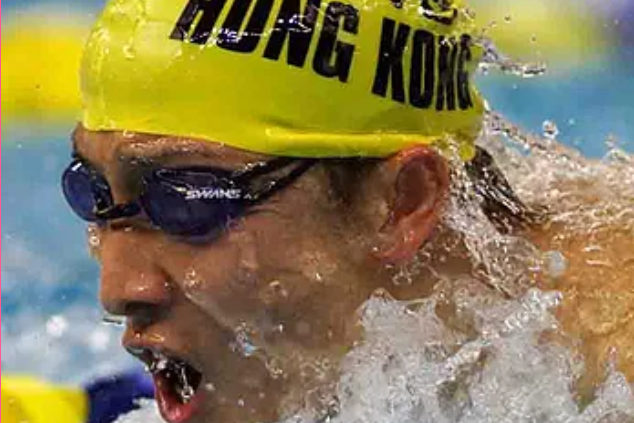 Coach guiding a swimmer