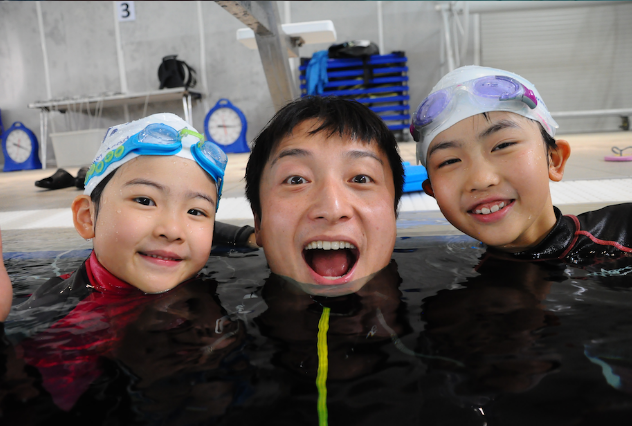 Young swimmer in lesson